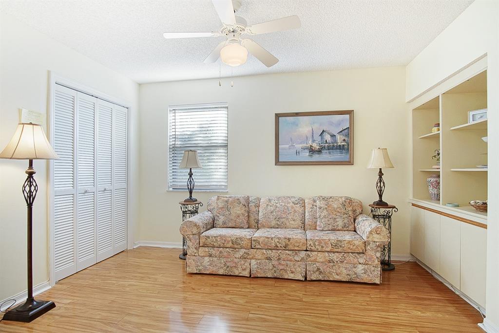 6081 Southeast Landing Way, Unit 9 Stuart, FL 34997 - Photo 18 of 31 a living room with furniture and a window