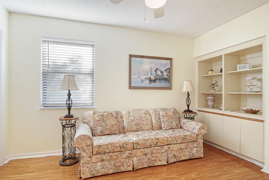 6081 Southeast Landing Way, Unit 9 Stuart, FL 34997 - Photo 19 of 31 a living room with furniture a window and a wooden floor