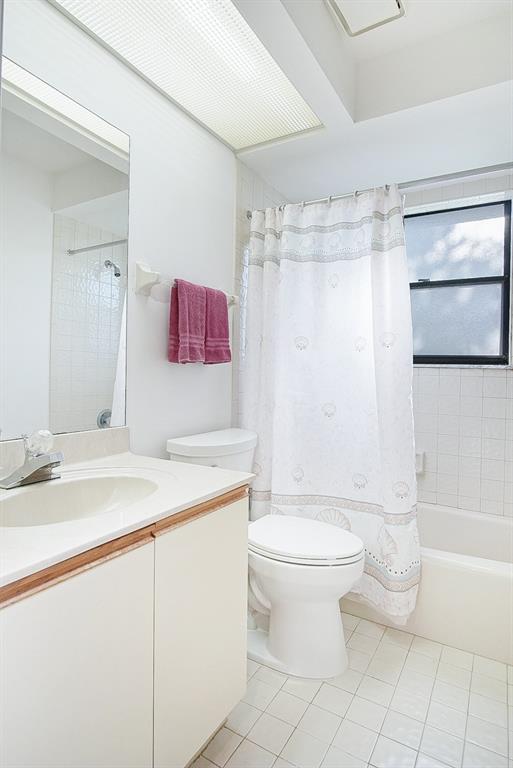 6081 Southeast Landing Way, Unit 9 Stuart, FL 34997 - Photo 20 of 31 a bathroom with a sink toilet and shower