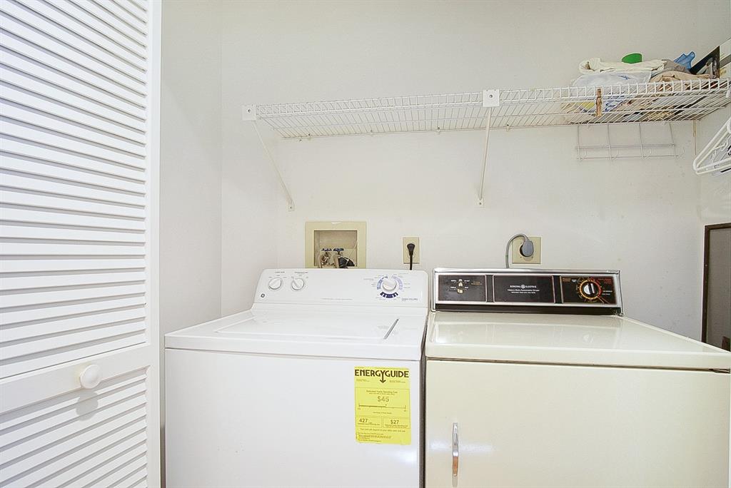 6081 Southeast Landing Way, Unit 9 Stuart, FL 34997 - Photo 21 of 31 a utility room with dryer and washer