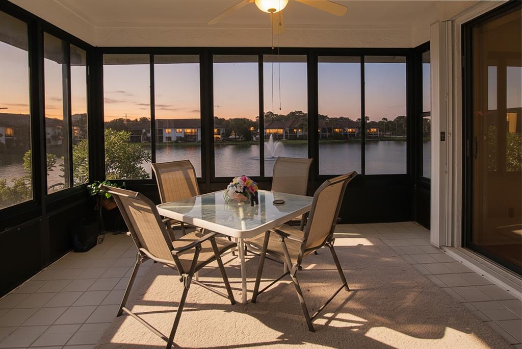 6081 Southeast Landing Way, Unit 9 Stuart, FL 34997 - Photo 22 of 31 a dining room with furniture and a floor to ceiling window