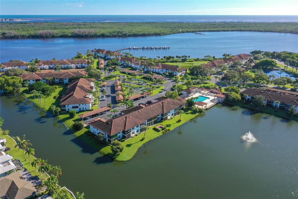 6081 Southeast Landing Way, Unit 9 Stuart, FL 34997 - Photo 26 of 31 a view of a lake with a city