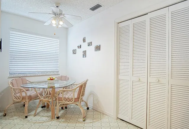 a dining room with furniture and window