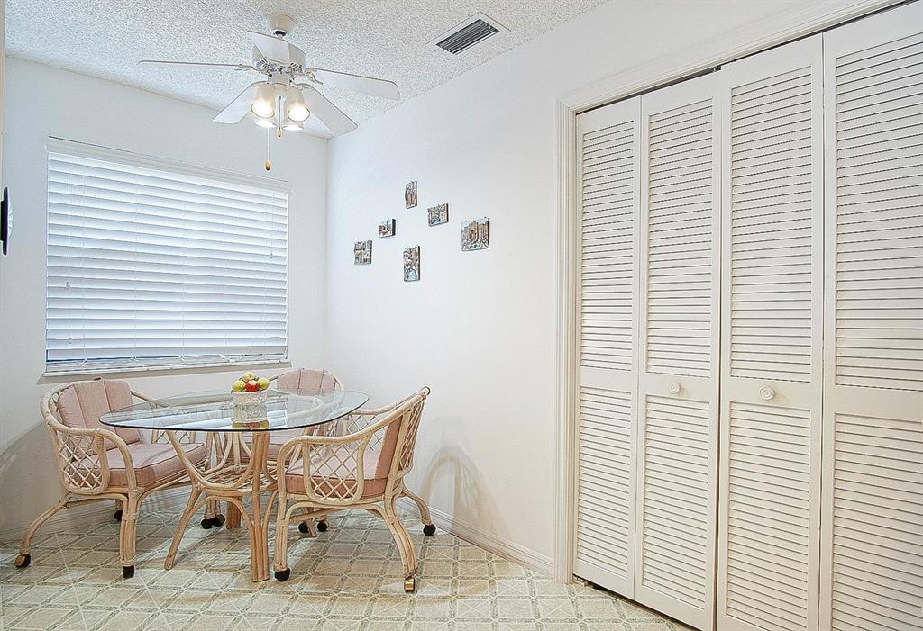 6081 Southeast Landing Way, Unit 9 Stuart, FL 34997 - Photo 7 of 31 a dining room with furniture and window