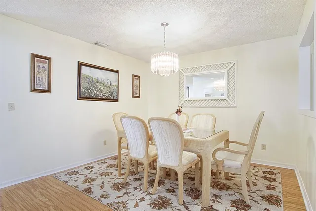 a dining room with table and chair