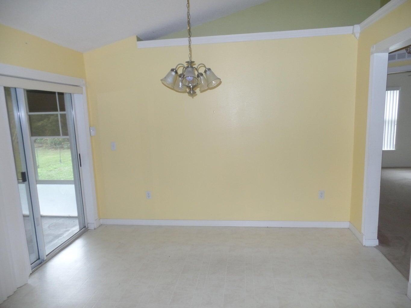 4210 Southwest Utterback Street Port St. Lucie, FL 34953 - Photo 6 of 7 a view of an empty room with a window