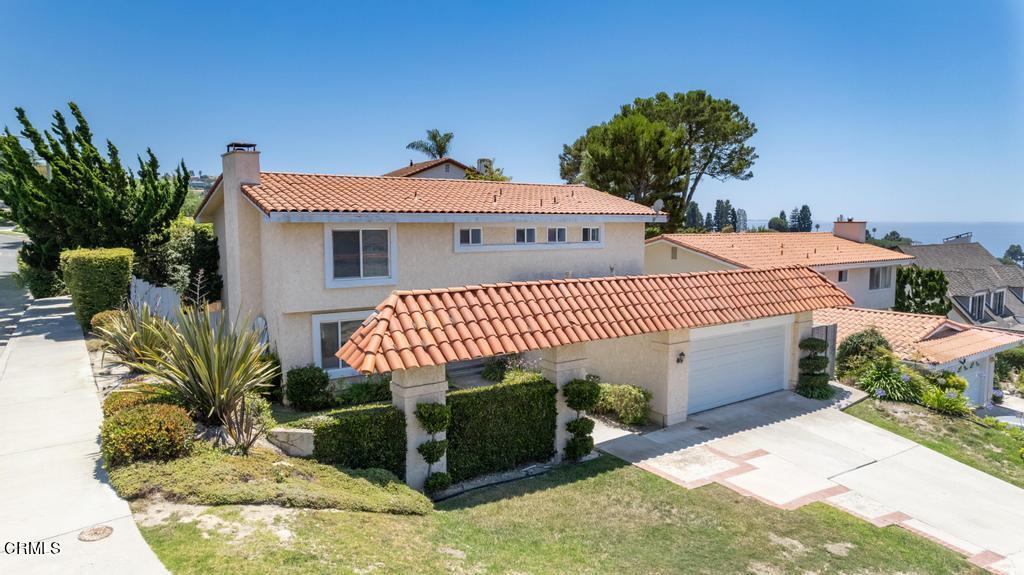 6802 Verde Ridge Road Rancho Palos Verdes, CA 90275 - Photo 1 of 46 a front view of a house with a garden