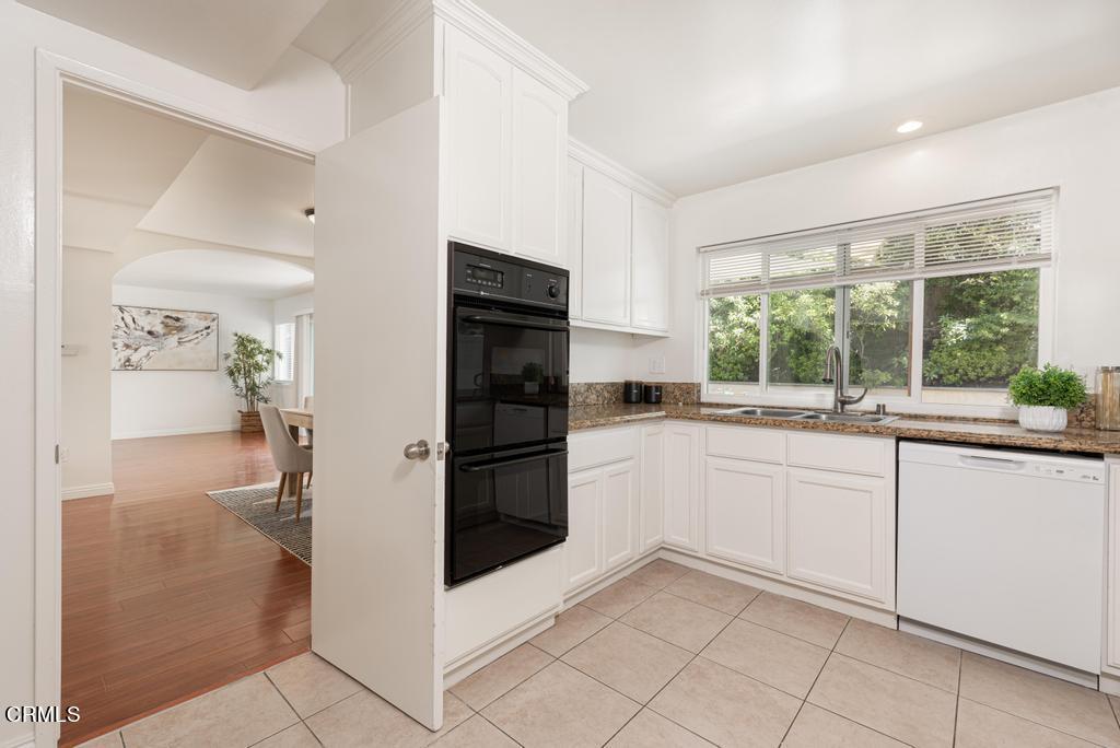 6802 Verde Ridge Road Rancho Palos Verdes, CA 90275 - Photo 11 of 46 a kitchen with a refrigerator and a sink