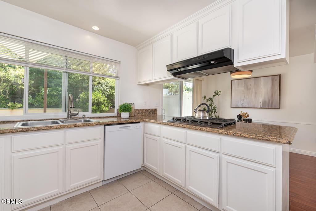 6802 Verde Ridge Road Rancho Palos Verdes, CA 90275 - Photo 13 of 46 a kitchen with granite countertop white cabinets and a sink