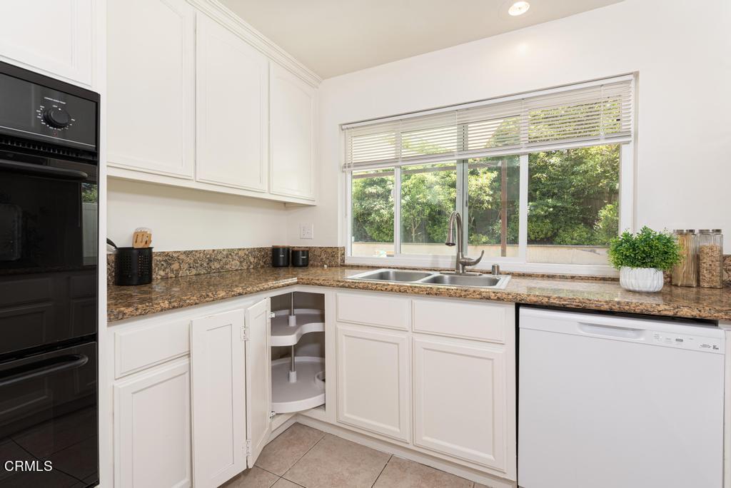6802 Verde Ridge Road Rancho Palos Verdes, CA 90275 - Photo 14 of 46 a kitchen with granite countertop white cabinets and white appliances
