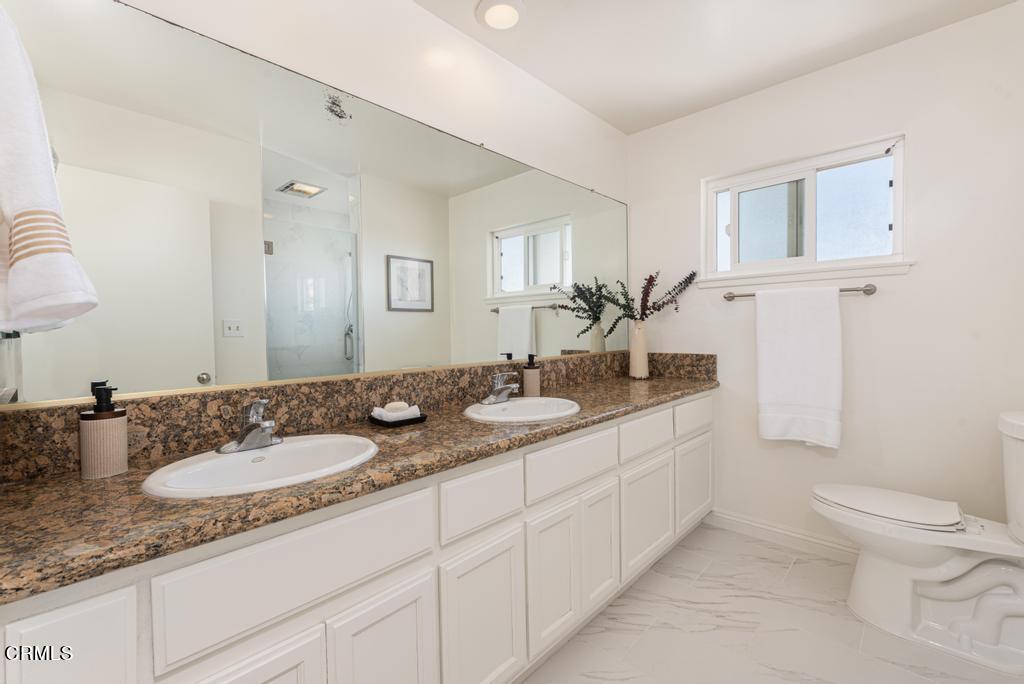 6802 Verde Ridge Road Rancho Palos Verdes, CA 90275 - Photo 25 of 46 a bathroom with a granite countertop sink mirror and toilet