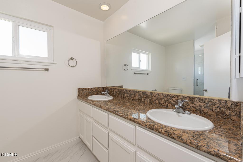 6802 Verde Ridge Road Rancho Palos Verdes, CA 90275 - Photo 29 of 46 a bathroom with a granite countertop sink and a mirror
