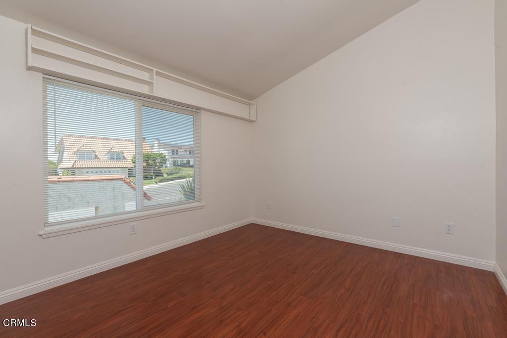 6802 Verde Ridge Road Rancho Palos Verdes, CA 90275 - Photo 33 of 46 an empty room with wooden floor and windows