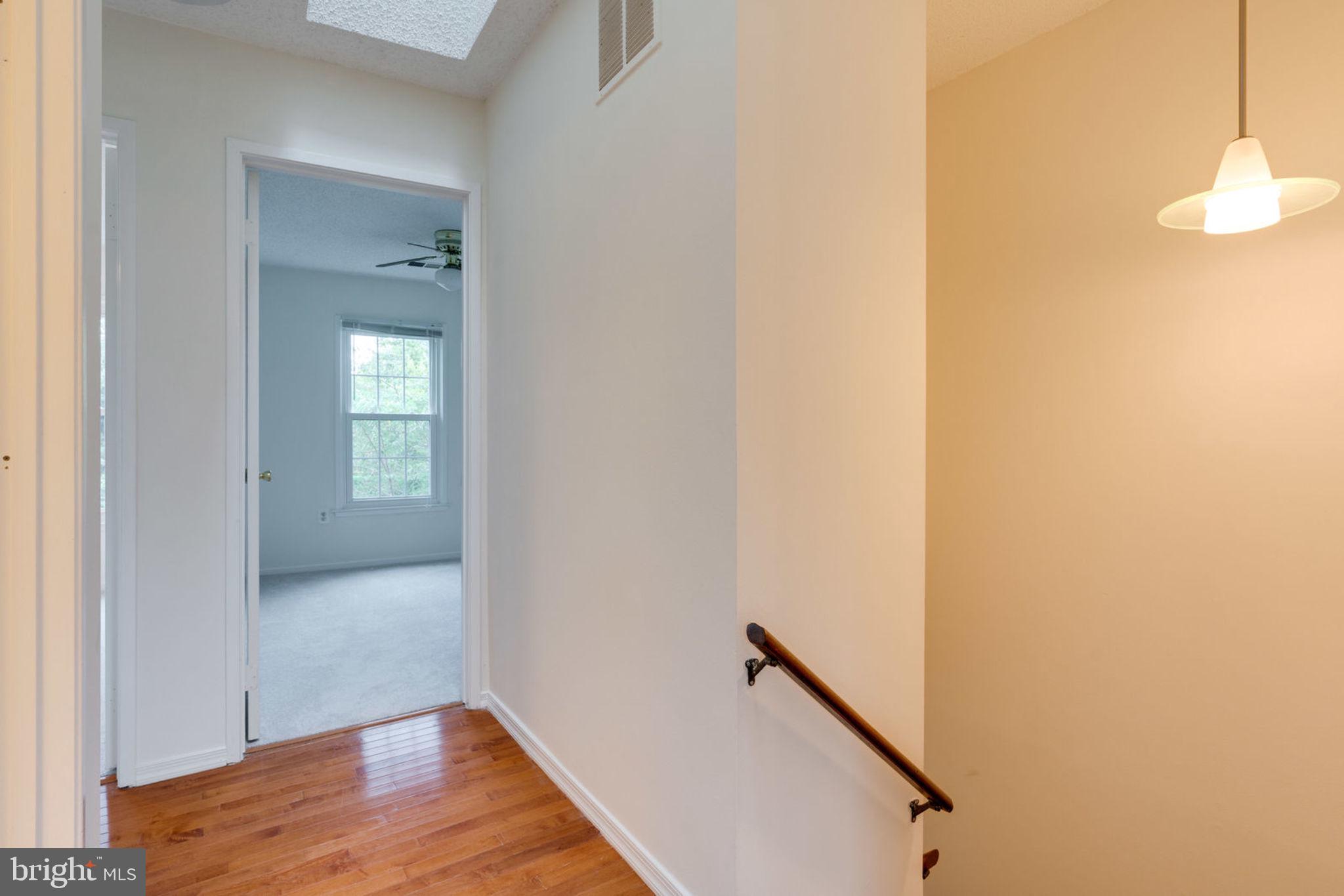 8903 Waites Way Lorton, VA 22079 - Photo 16 of 44 Upper level Wood floor Hallway.