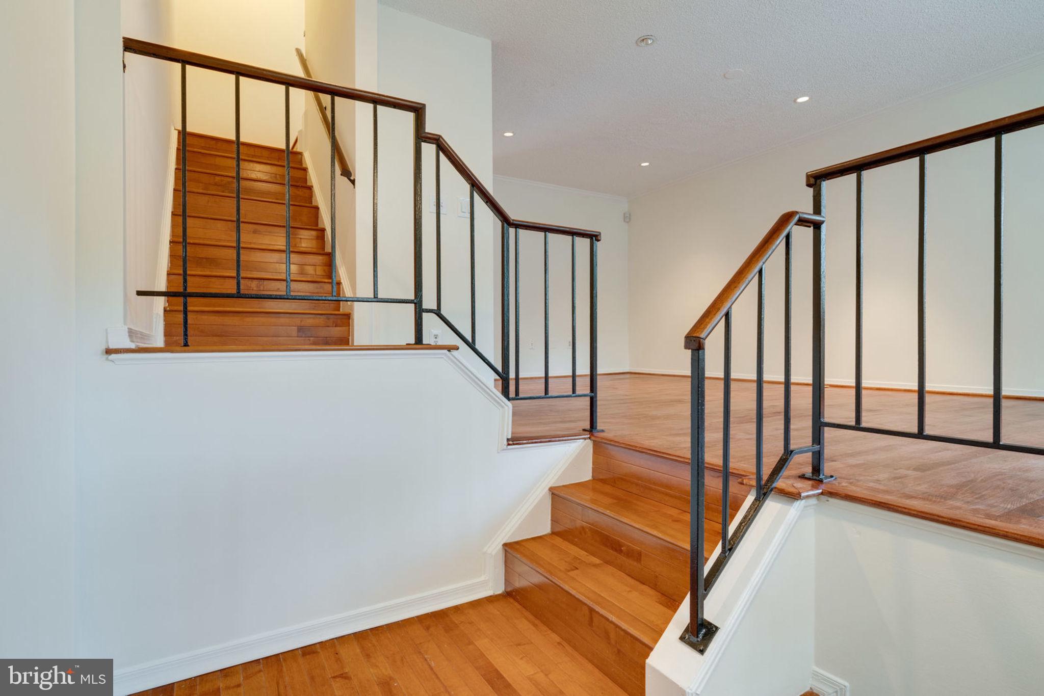 8903 Waites Way Lorton, VA 22079 - Photo 3 of 44 Wood Stairs from the foyer to the main level.