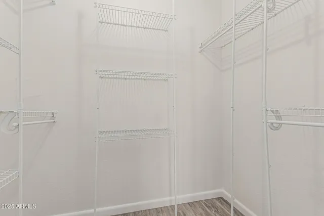 a view of an empty walk in closet