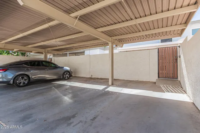 a view of parking garage with cars parked