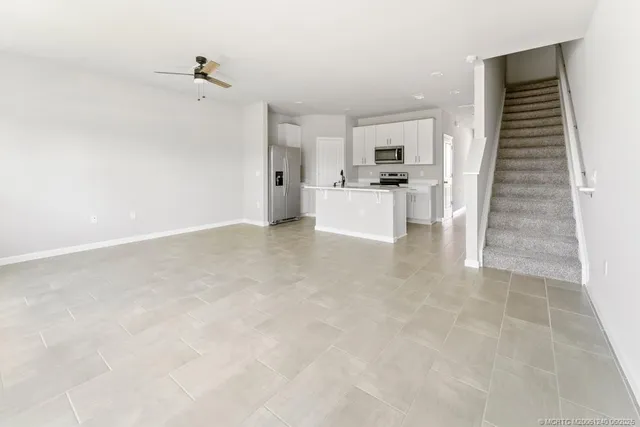 a view of kitchen with microwave and cabinets