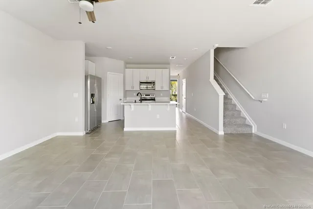 a view of a kitchen with furniture and a kitchen view