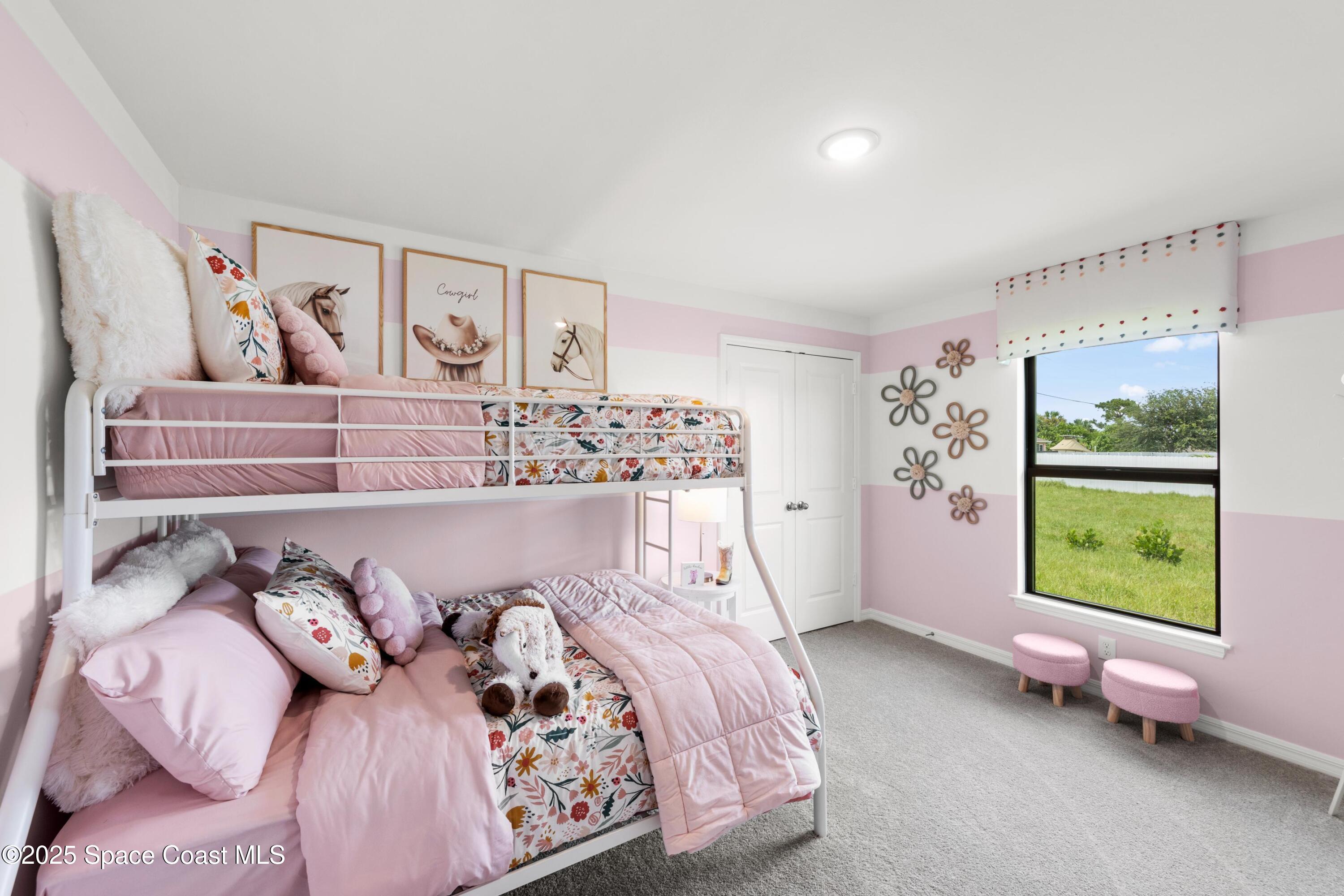 2847 Digby Road Southeast Palm Bay, FL 32909 - Photo 13 of 14 a bed sitting in a bedroom next to a window