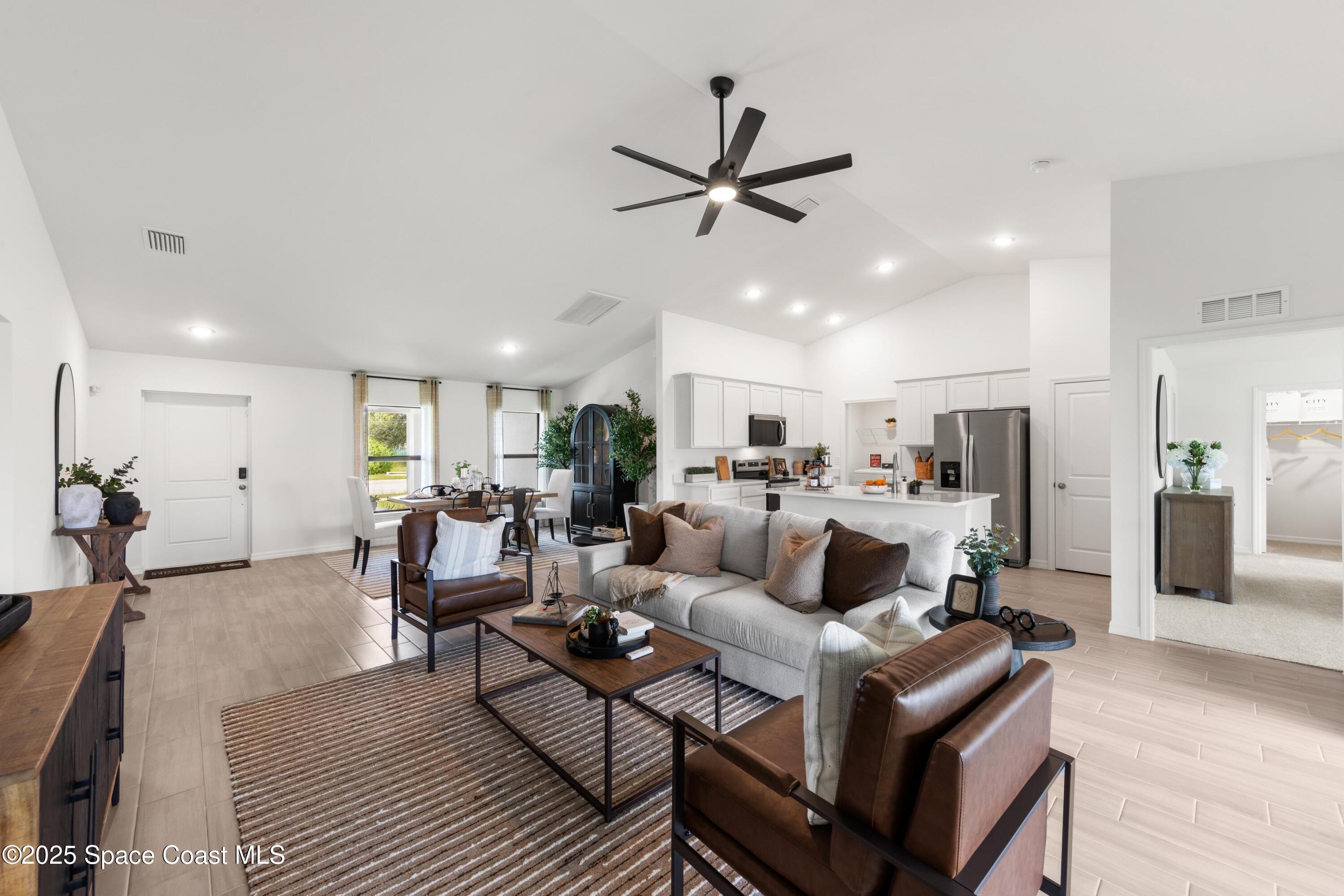 2847 Digby Road Southeast Palm Bay, FL 32909 - Photo 7 of 14 a living room with furniture and a wooden floor