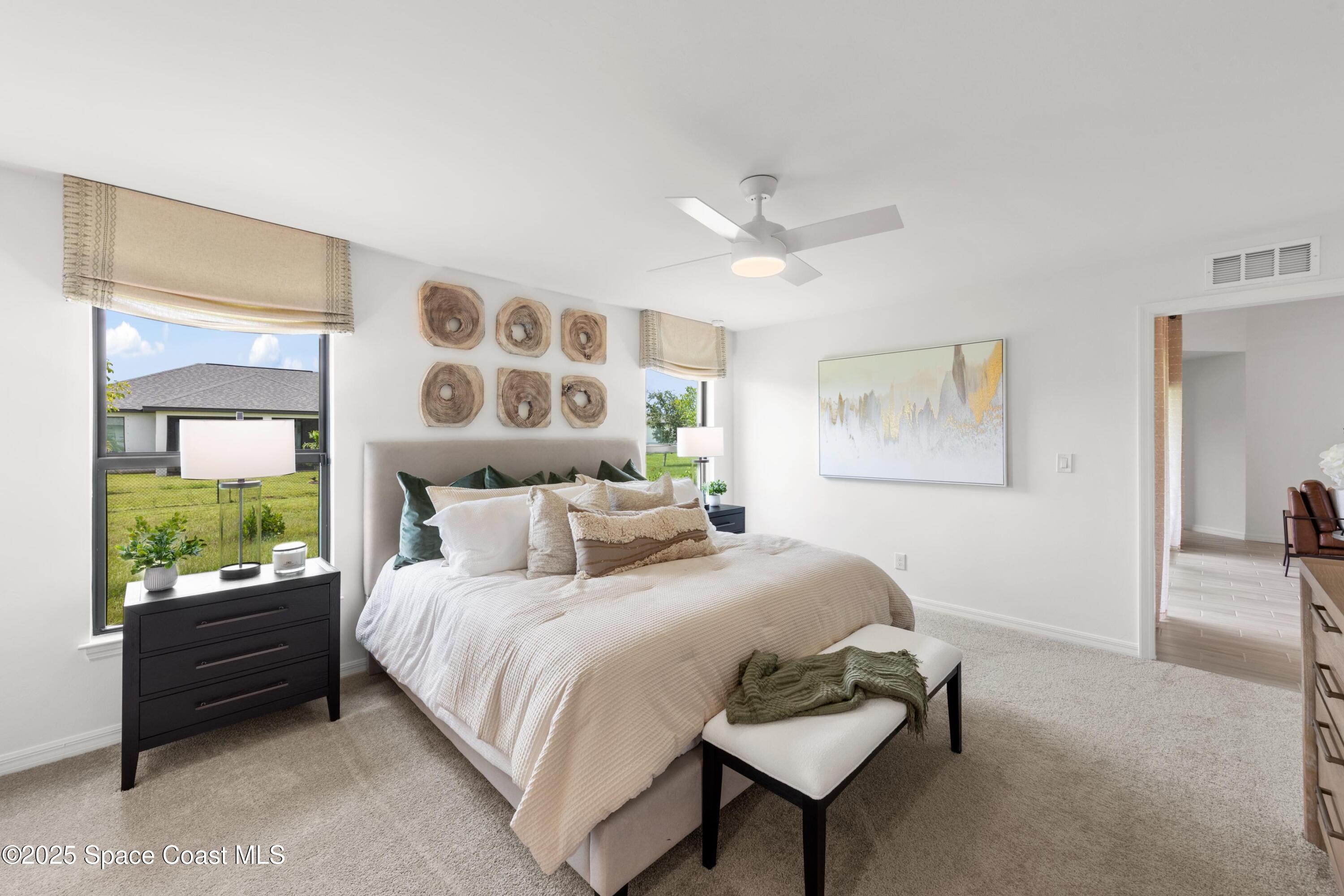 2847 Digby Road Southeast Palm Bay, FL 32909 - Photo 9 of 14 a bedroom with a bed and a painting on the wall