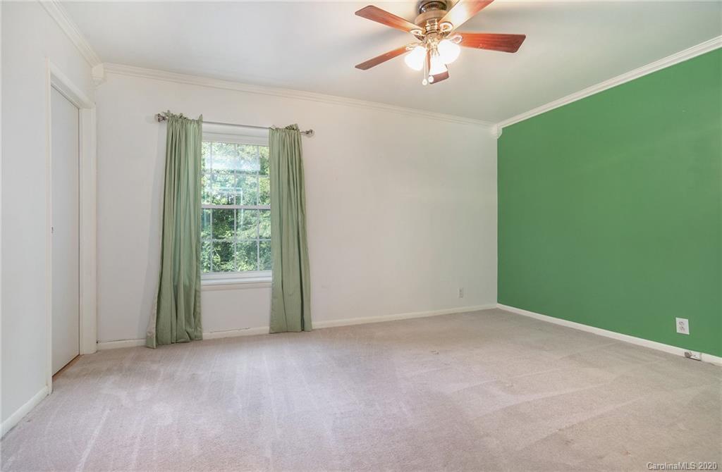 2628 Park Road, Unit H Charlotte, NC 28209 - Photo 16 of 39 a view of an empty room with a window