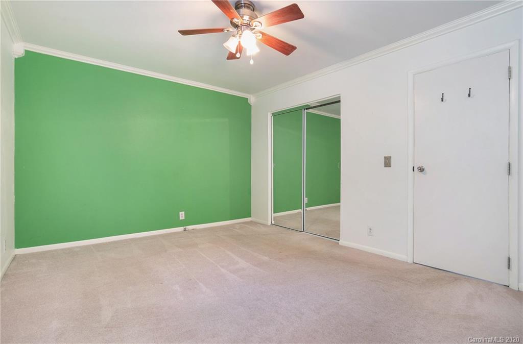2628 Park Road, Unit H Charlotte, NC 28209 - Photo 17 of 39 a view of an empty room with a fan