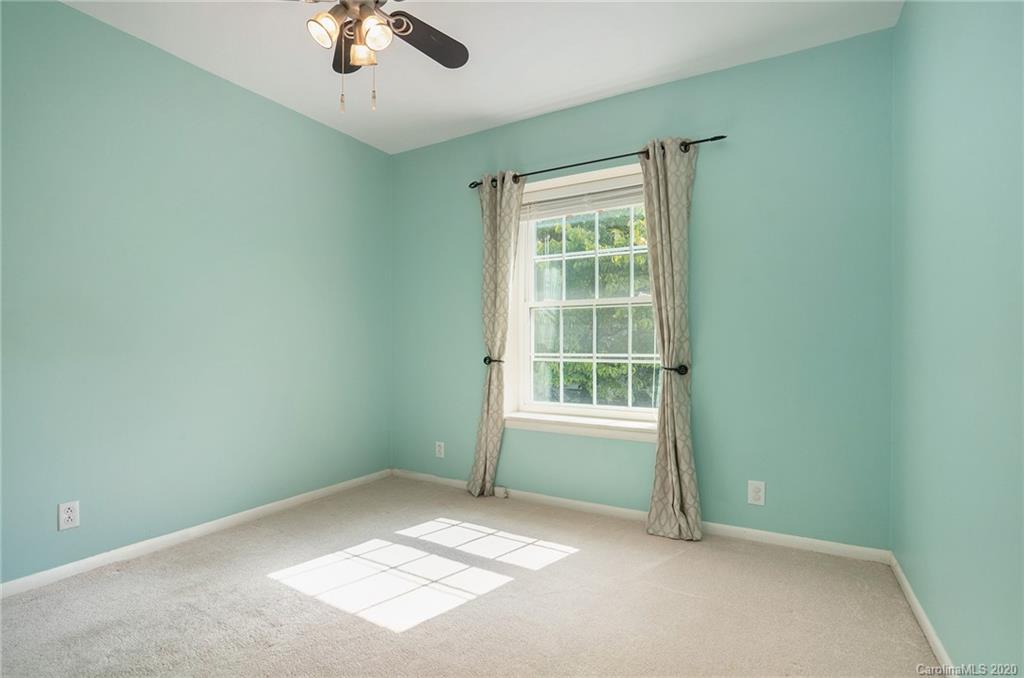 2628 Park Road, Unit H Charlotte, NC 28209 - Photo 20 of 39 an empty room with a window