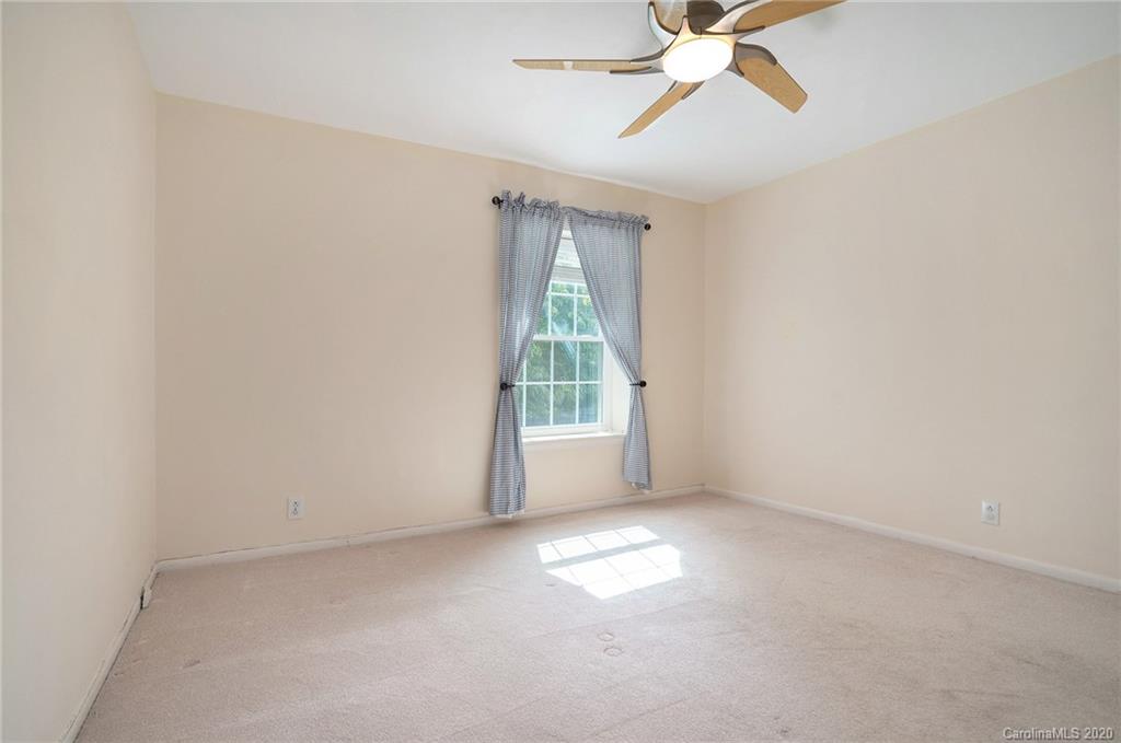 2628 Park Road, Unit H Charlotte, NC 28209 - Photo 27 of 39 a view of an empty room with a window