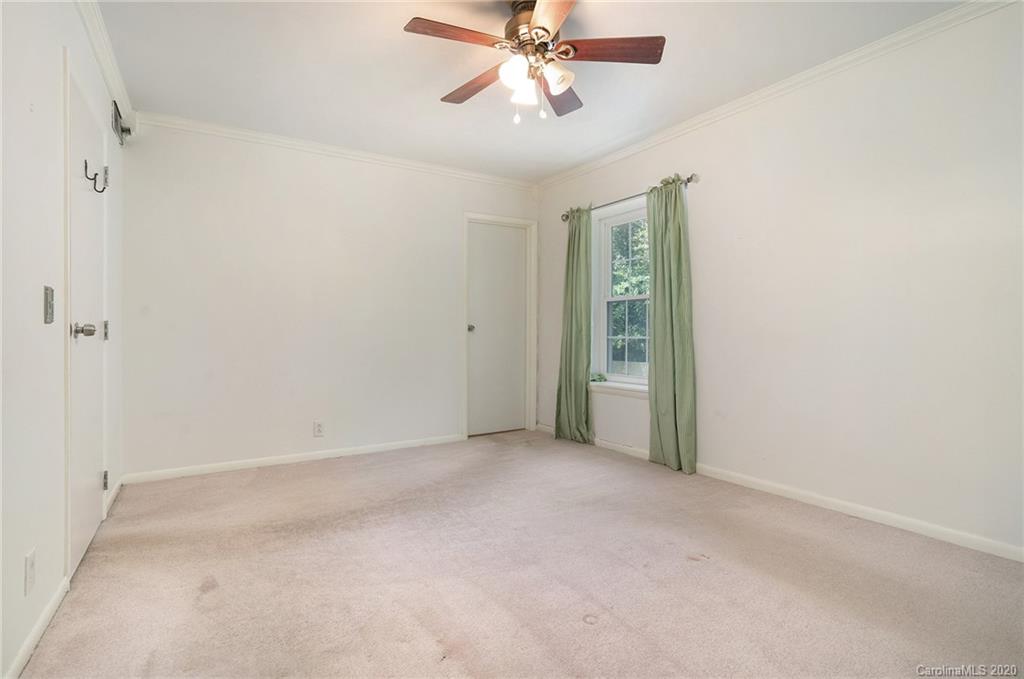 2628 Park Road, Unit H Charlotte, NC 28209 - Photo 30 of 39 a view of an empty room and chandelier fan