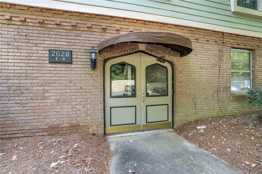 2628 Park Road, Unit H Charlotte, NC 28209 - Photo 37 of 39 a view of entryway with a wooden fence