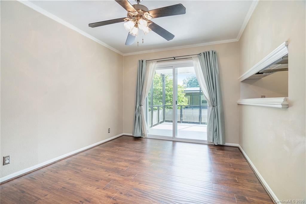 2628 Park Road, Unit H Charlotte, NC 28209 - Photo 8 of 39 an empty room with wooden floor and windows
