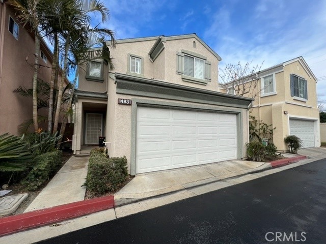 14831 Sampson Court Tustin, CA 92780 - Photo 2 of 2 a front view of a house with a garage