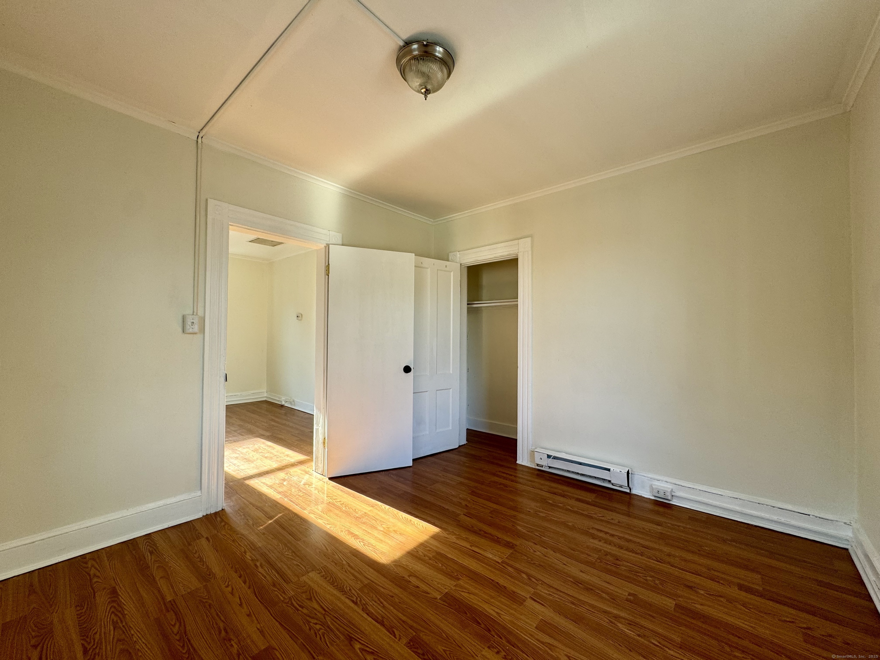 14 Culvert Street, Unit 2 Torrington, CT 06790 - Photo 5 of 17 a view of an empty room with wooden floor