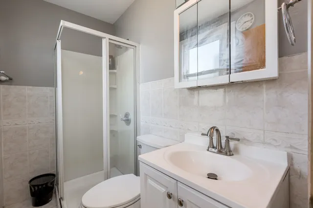 a bathroom with a sink toilet and vanity