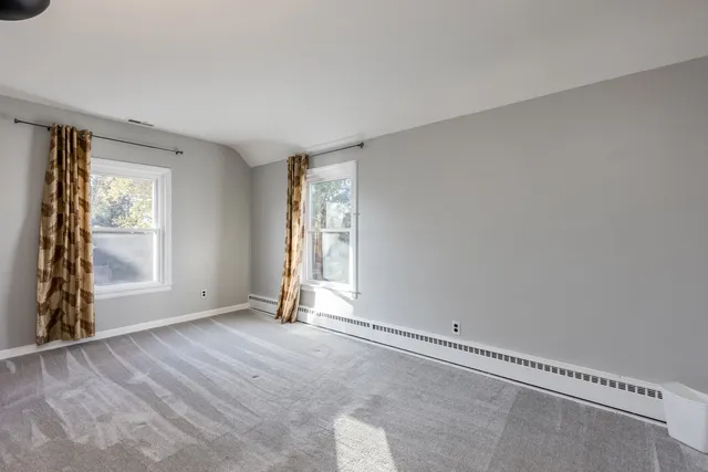 an empty room with windows