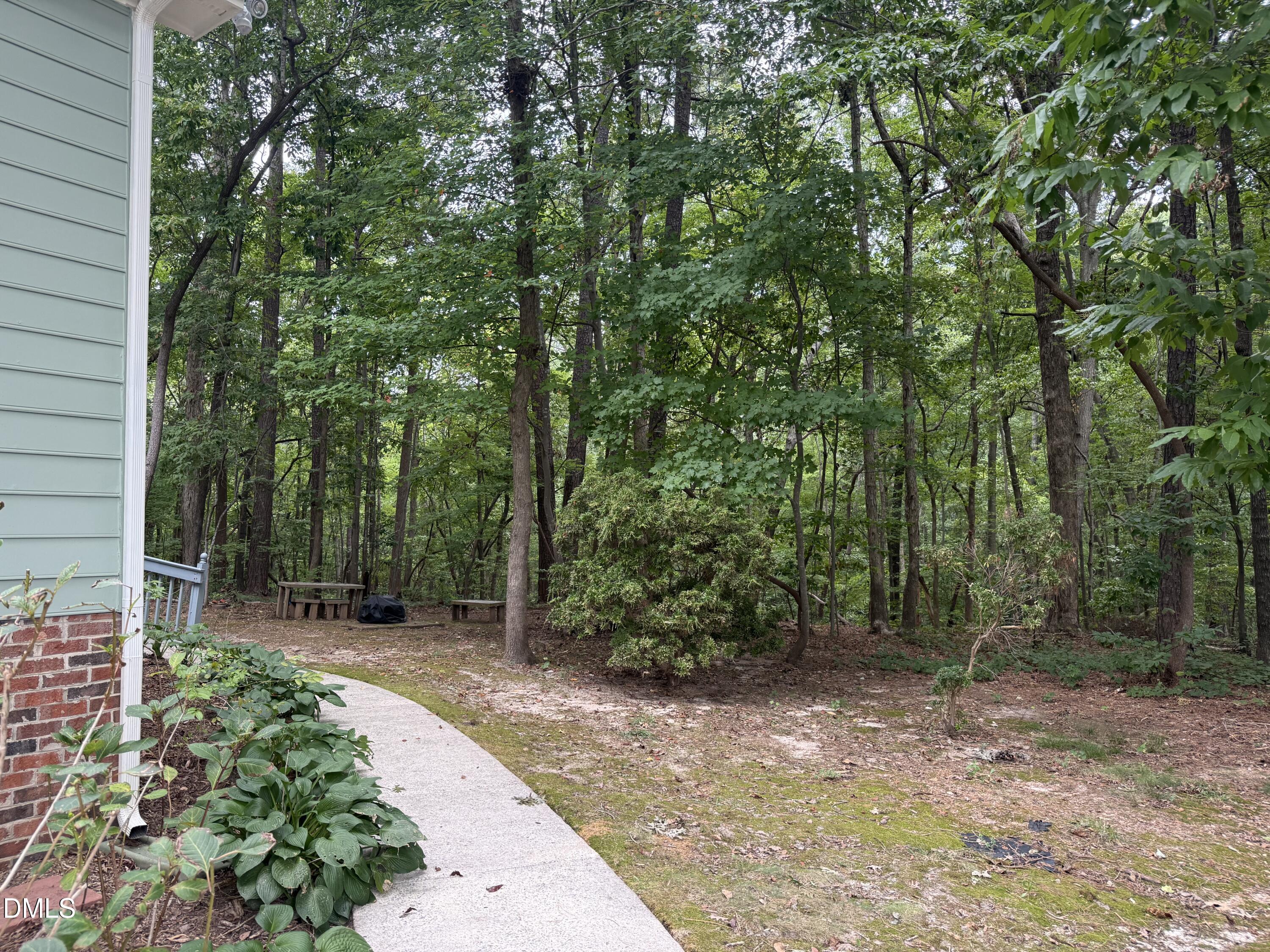 400 Oak Run Drive Raleigh, NC 27606 - Photo 4 of 27 Sidewalk to back of the townhouse