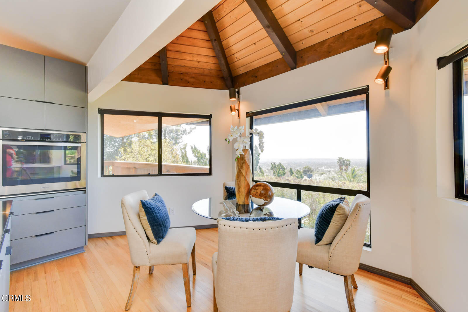 3680 Ranch Top Road Pasadena, CA 91107 - Photo 11 of 54 a dining room with furniture a rug and a large window