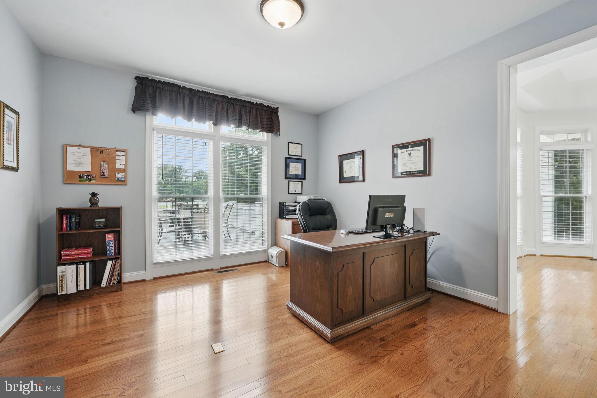 40755 Lenah Run Circle Aldie, VA 20105 - Photo 12 of 37 a living room with furniture and a flat screen tv