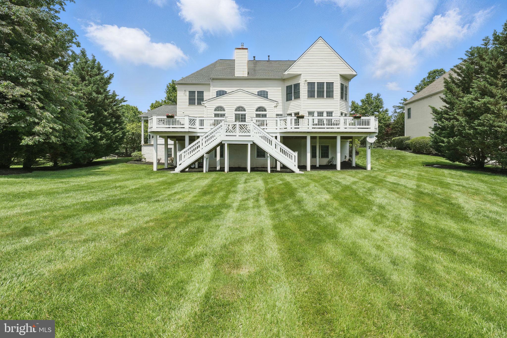 40755 Lenah Run Circle Aldie, VA 20105 - Photo 2 of 37 a white house that has a big yard with plants and large trees