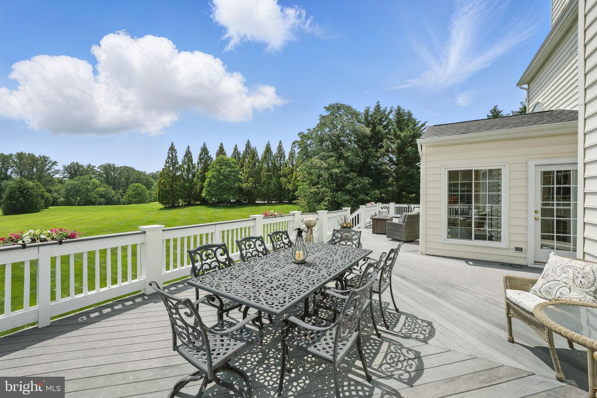 40755 Lenah Run Circle Aldie, VA 20105 - Photo 30 of 37 a view of a wooden chairs and table on the deck