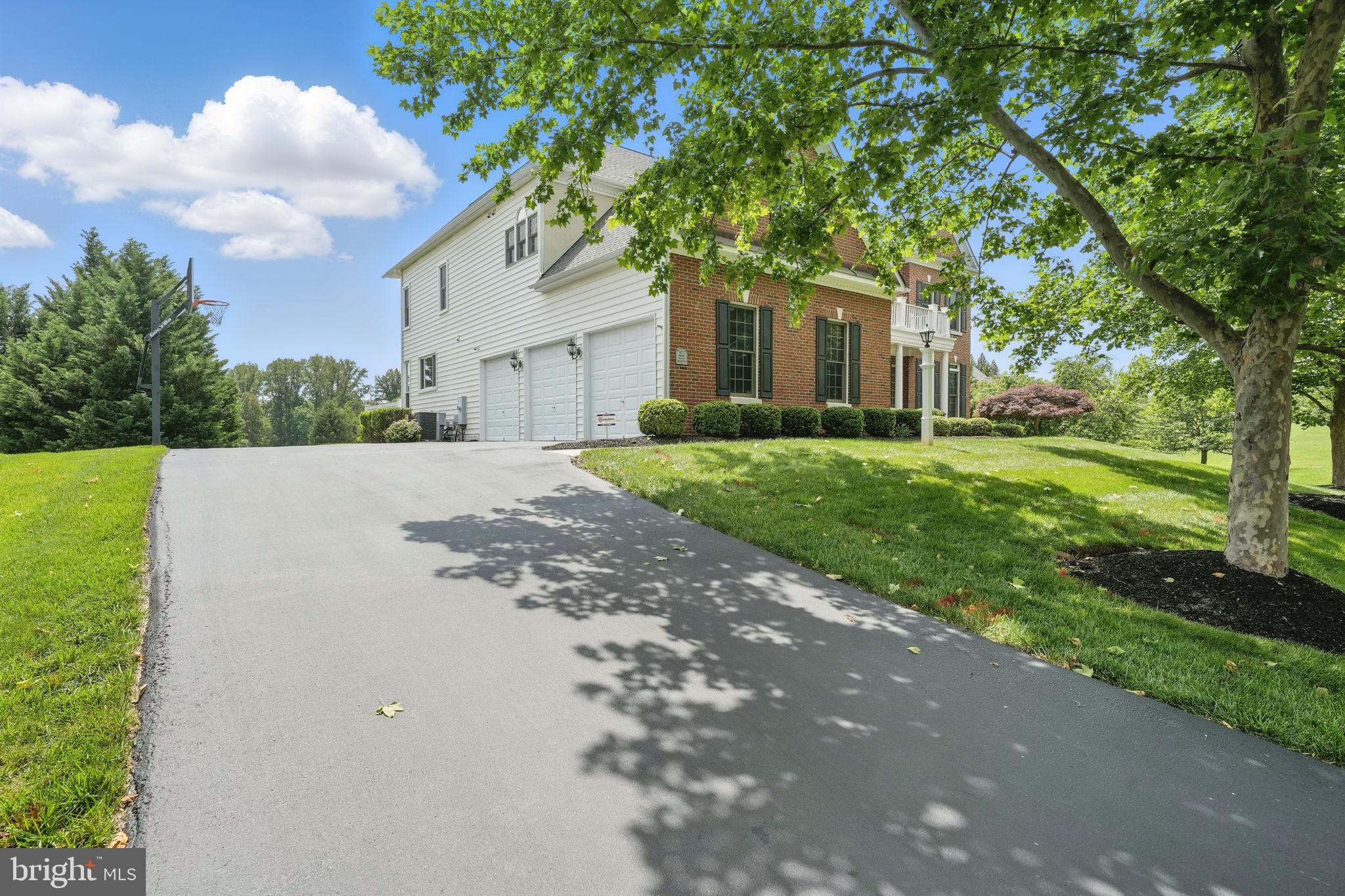 40755 Lenah Run Circle Aldie, VA 20105 - Photo 32 of 37 a front view of a house with a yard and garage