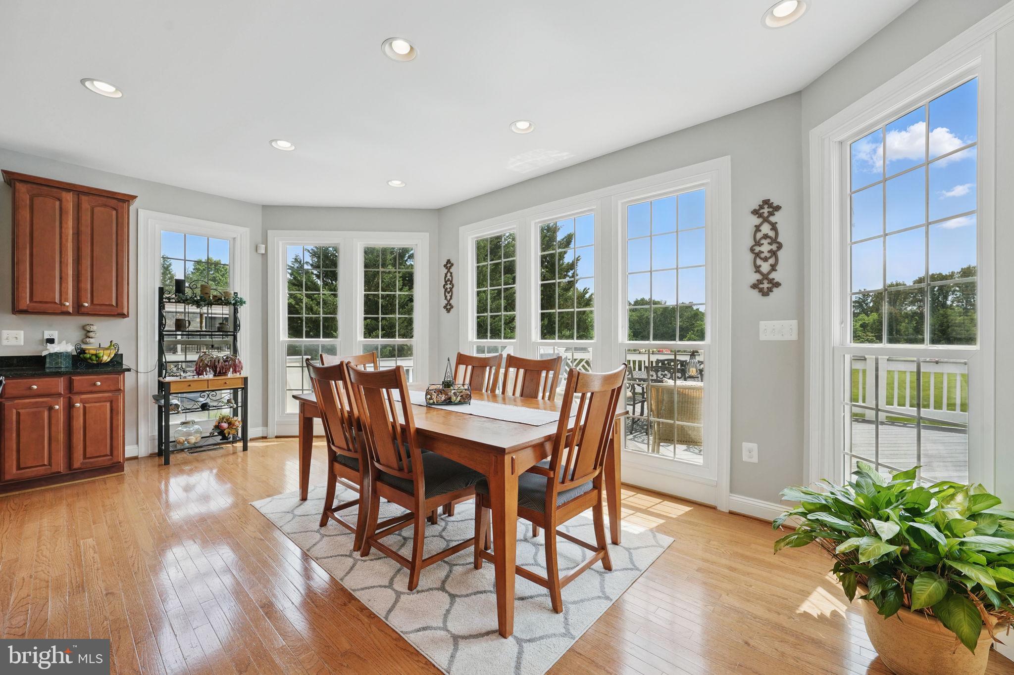 40755 Lenah Run Circle Aldie, VA 20105 - Photo 6 of 37 a view of a dining room with furniture window and wooden floor
