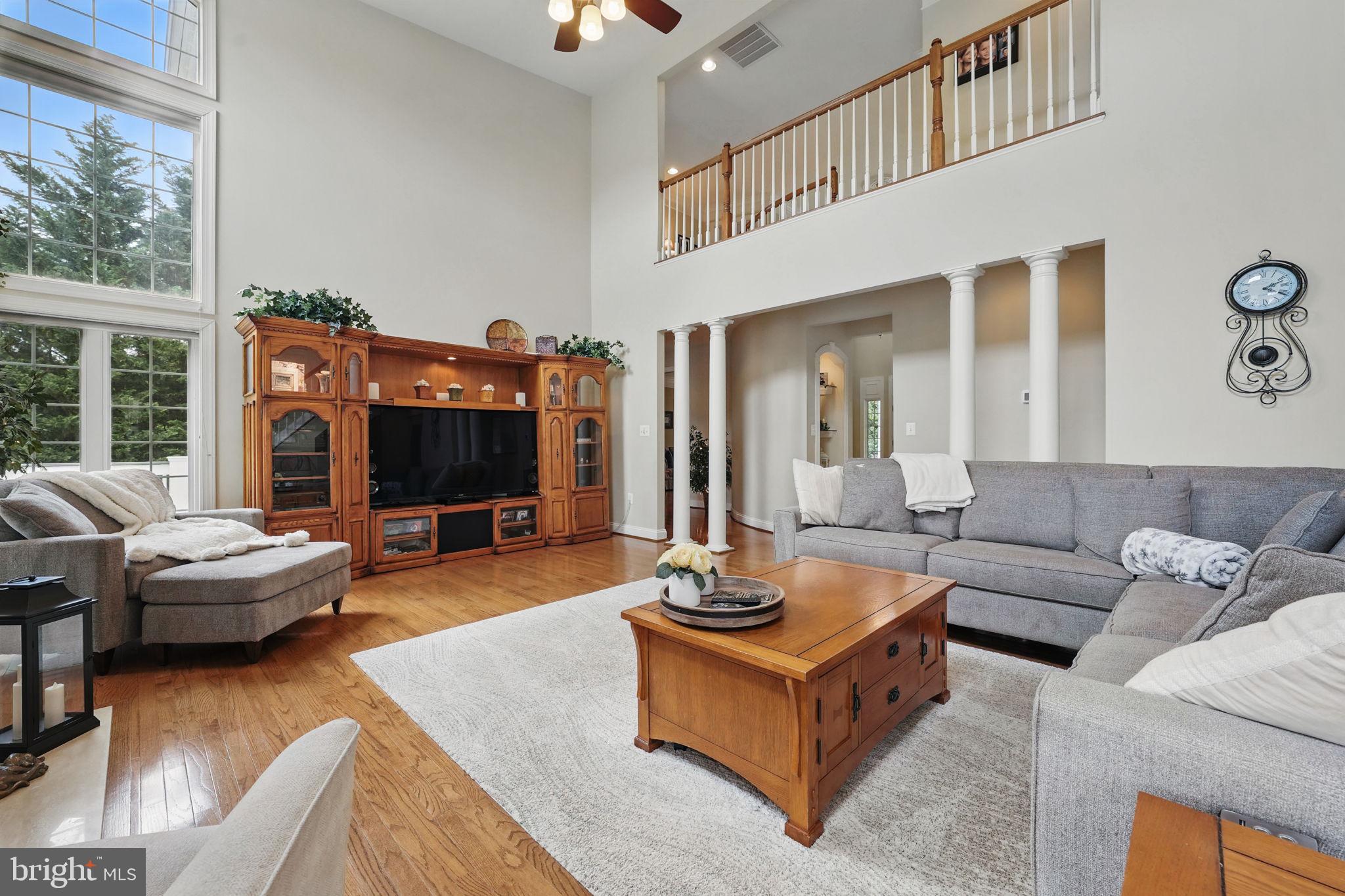 40755 Lenah Run Circle Aldie, VA 20105 - Photo 8 of 37 a living room with furniture and a flat screen tv