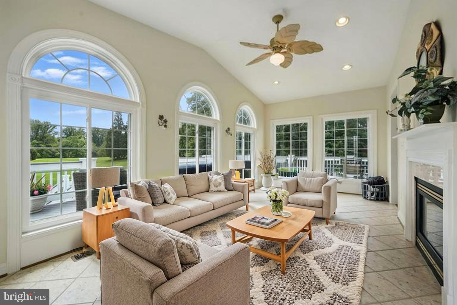 40755 Lenah Run Circle Aldie, VA 20105 - Photo 9 of 37 a living room with furniture a fireplace and a chandelier