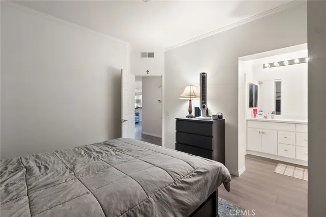 a bedroom with a bed and a mirror