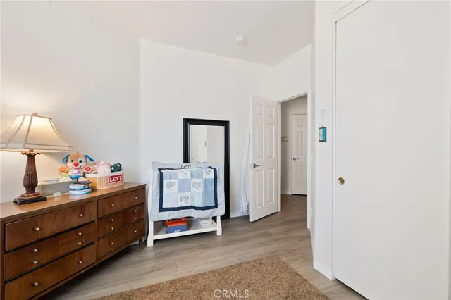 a room with a dresser and a mirror