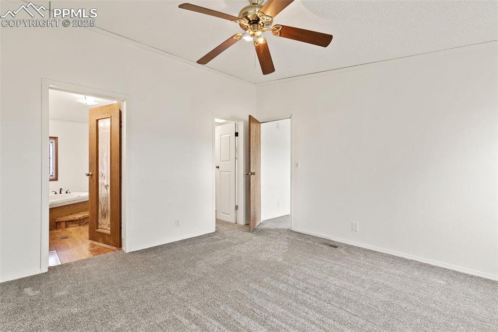 5915 West Condor Road Peyton, CO 80831 - Photo 24 of 50 Primary bedroom with attached bath and walk in closet