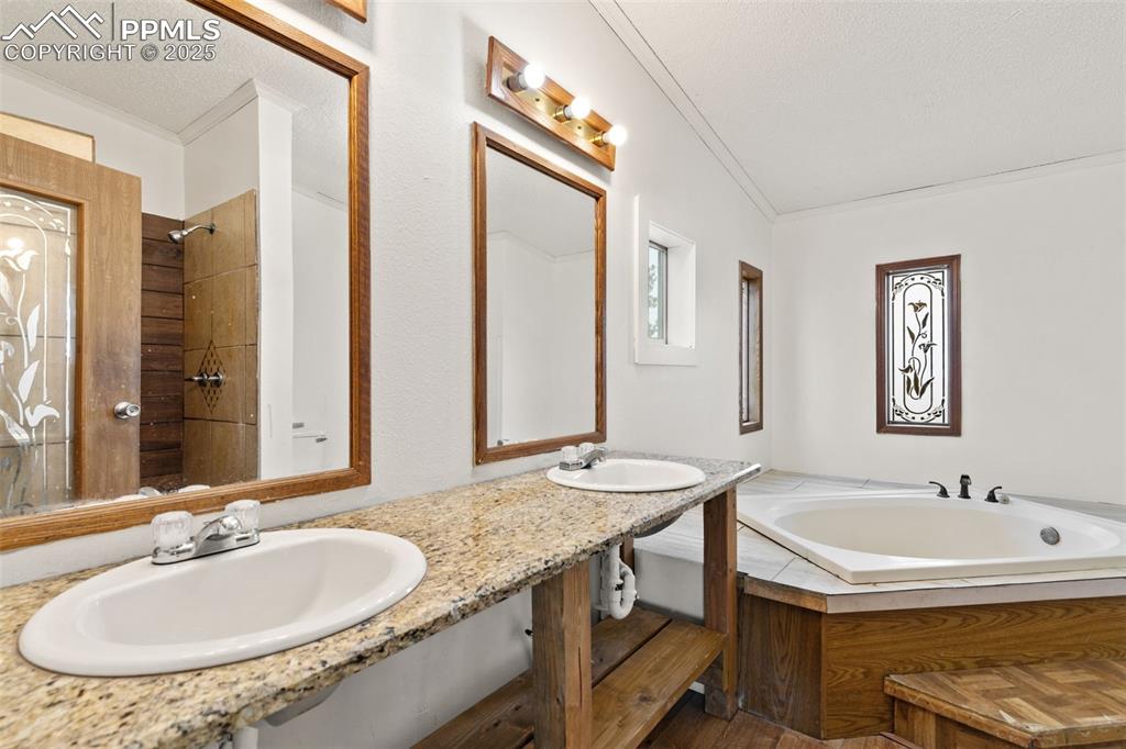 5915 West Condor Road Peyton, CO 80831 - Photo 25 of 50 5 piece primary bathroom